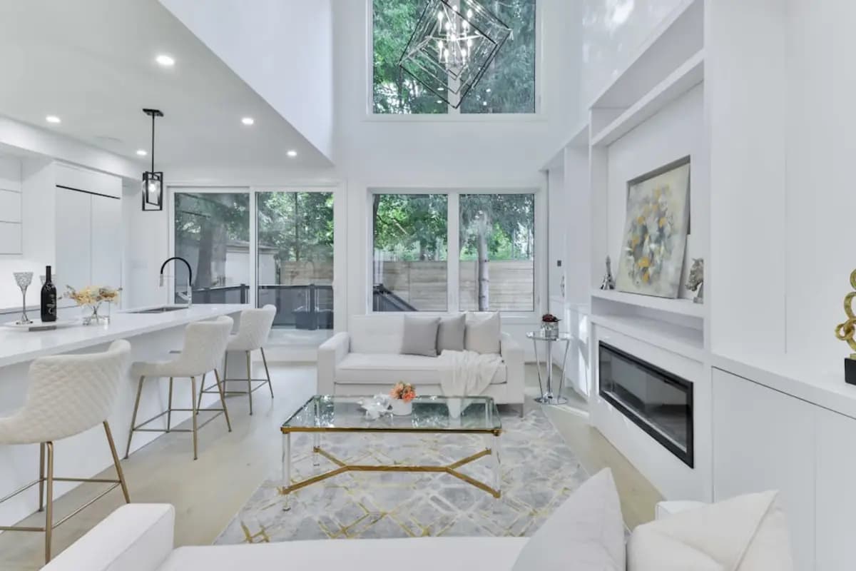 A refurbished open-plan living room finished in white